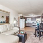 The open living room and kitchen in our 1 bedroom model apartment