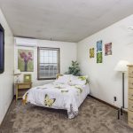 View of the bedroom in an upstairs one bedroom apartment