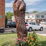 A tree trunk carved to look like a bear